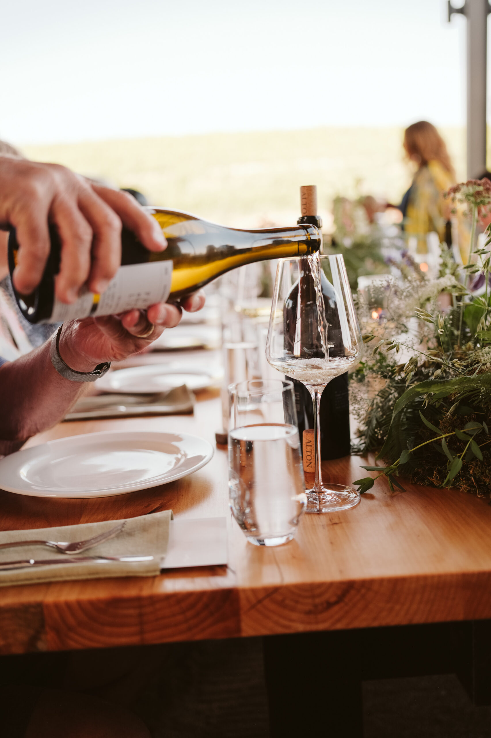 Pouring a glass at an Alton Wines gathering