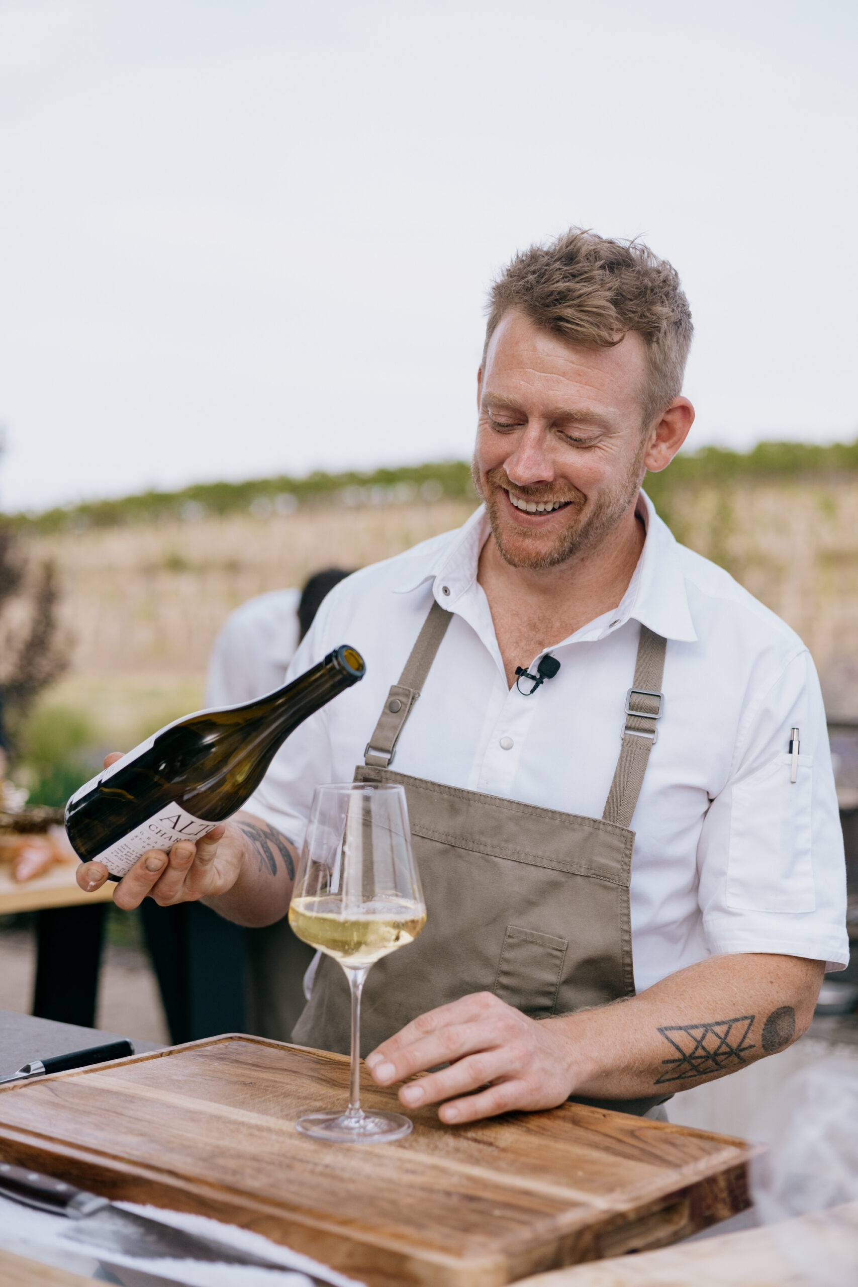 The chef pouring wine