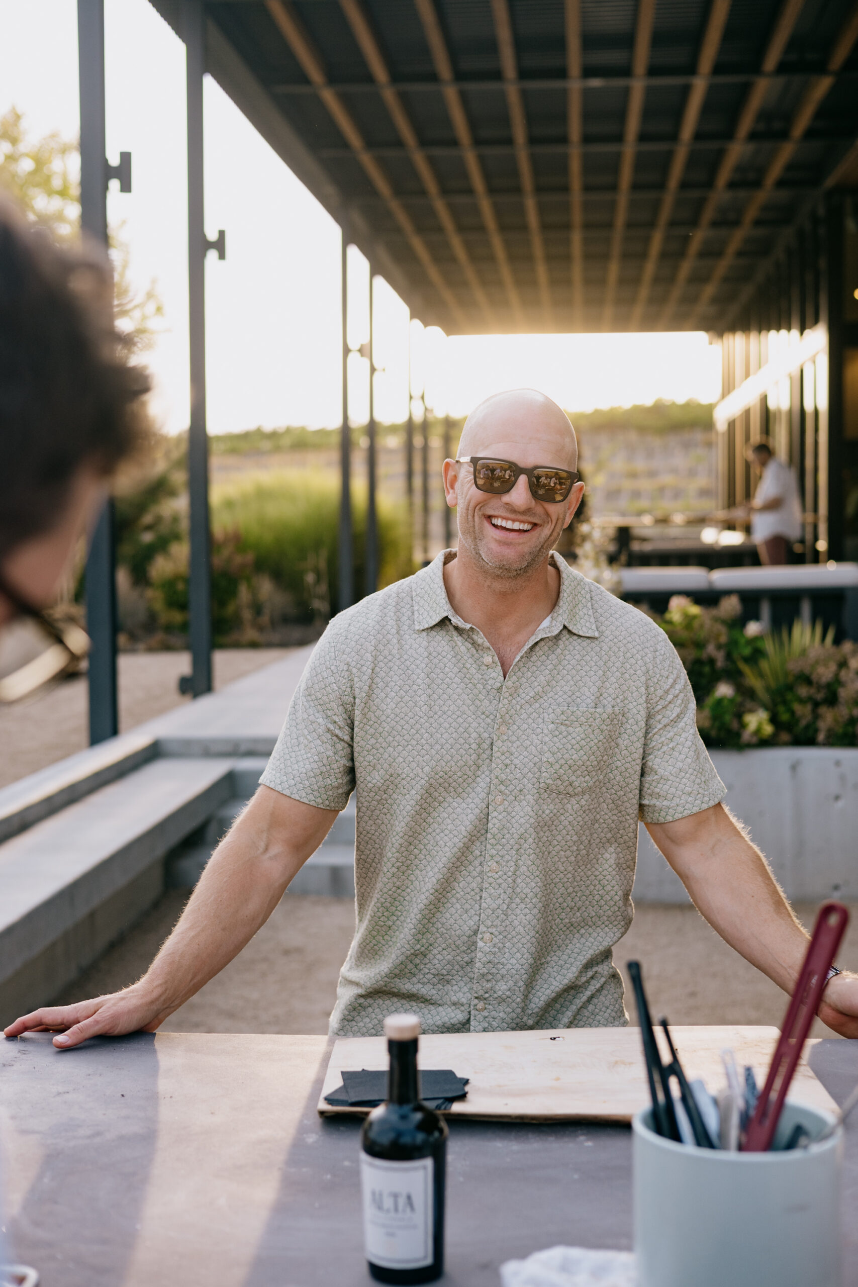 Joe smiling at the outdoor kitchen