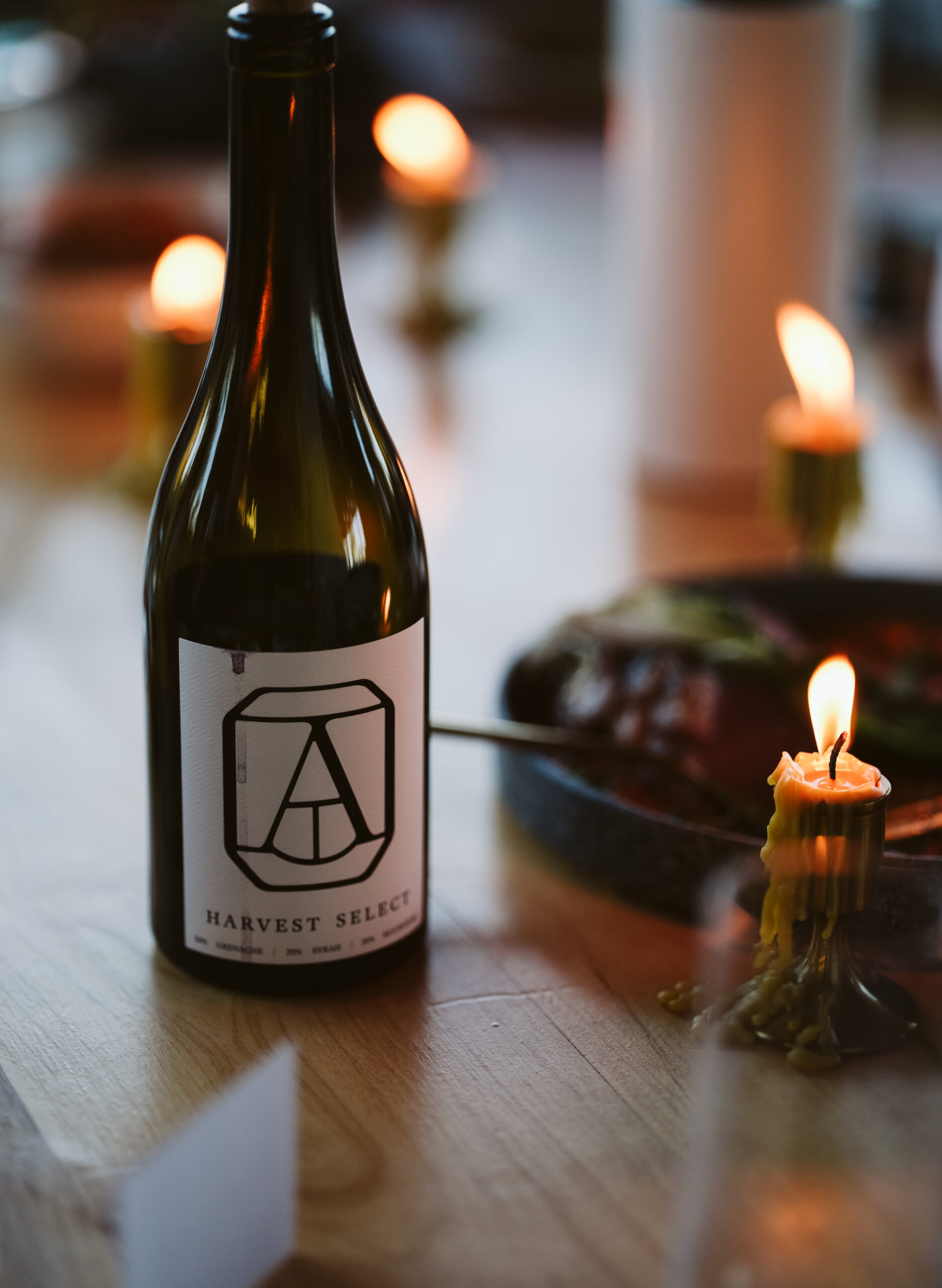 An Alton Harvest Select bottle on a candlelit table